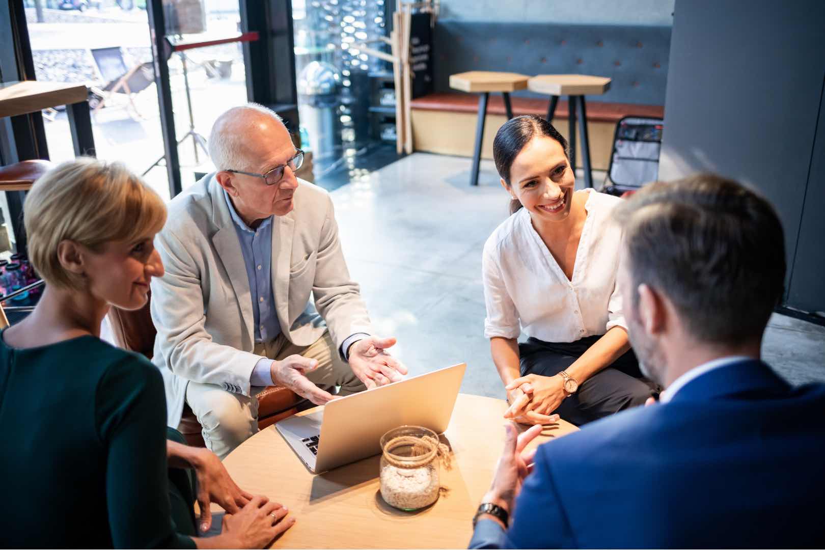Business leaders reviewing progress with their Microsoft consultancy partner